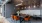 Table with orange chairs and lights