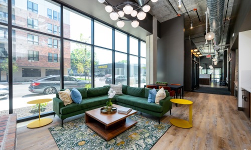 Leasing office with high ceilings and large windows