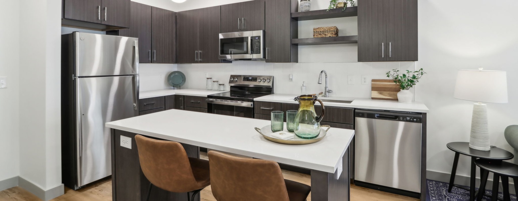 Styled apartment kitchen with pendant lights