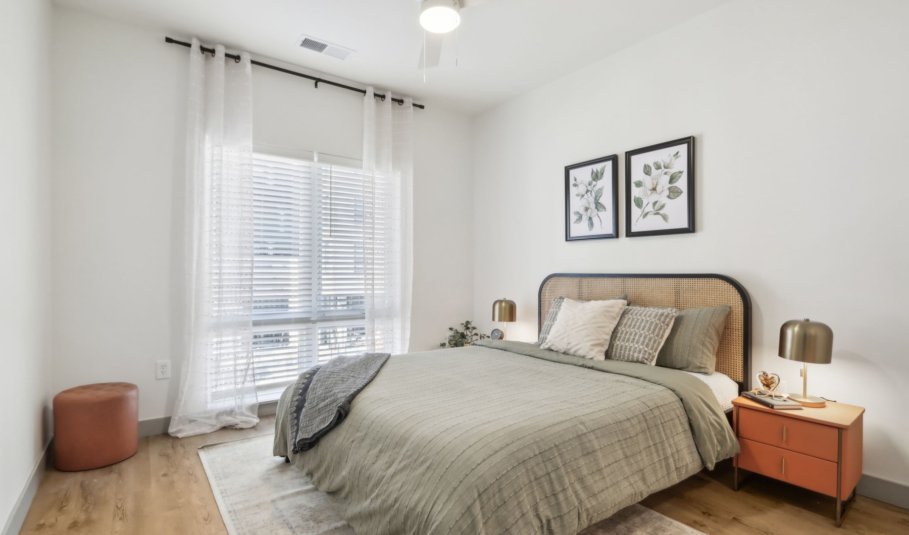 Unwind in your stylish Indy apartment Styled apartment bedroom with ceiling fan