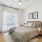 Styled apartment bedroom with ceiling fan