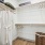 Closet with storage shelves and styling